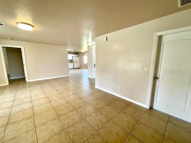 view of tiled spare room