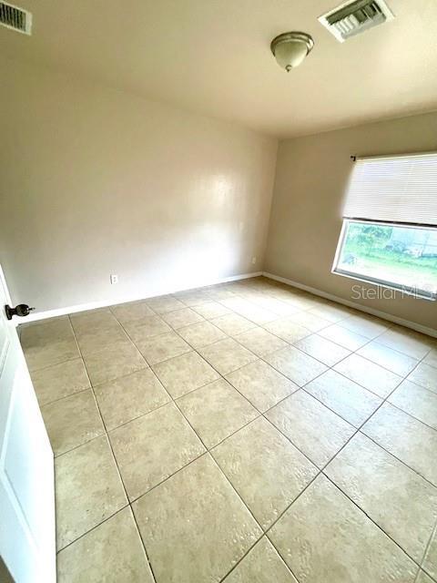 view of tiled spare room