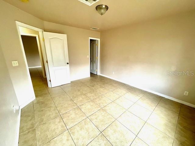 view of tiled spare room