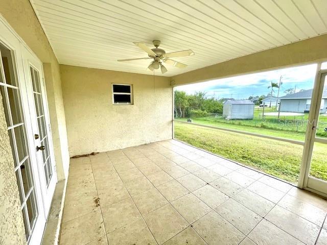 view of patio / terrace featuring french doors and ceiling fan