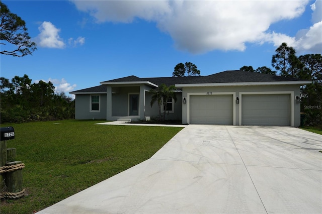 view of front of home featuring an attached garage, stucco siding, driveway, and a front yard