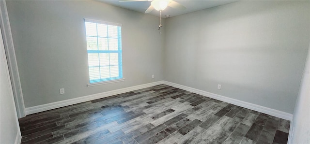 unfurnished room featuring plenty of natural light, baseboards, and dark wood-type flooring