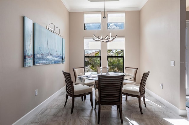 17122 Barcrest Ln, Punta Gorda, FL 33955 - dining room with a chandelier, crown molding, and plenty of natural light