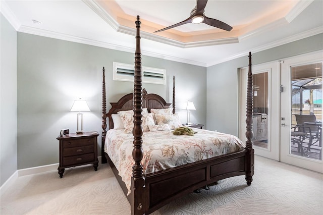 17122 Barcrest Ln, Punta Gorda, FL 33955 - bedroom with a tray ceiling, light carpet, access to exterior, ornamental molding, and ceiling fan