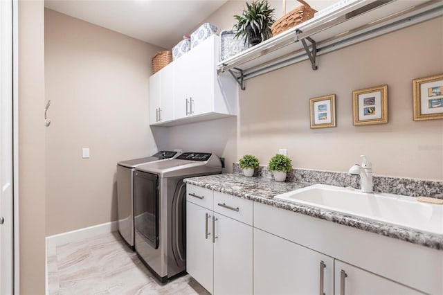 17122 Barcrest Ln, Punta Gorda, FL 33955 - laundry area featuring washer and dryer, cabinet space, and light marble finish flooring