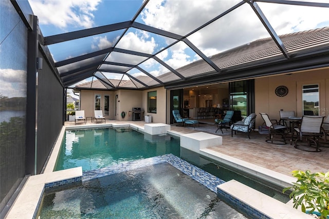 17122 Barcrest Ln, Punta Gorda, FL 33955 - view of pool with a pool with connected hot tub, a patio, glass enclosure, and outdoor dining area