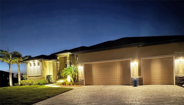 17122 Barcrest Ln, Punta Gorda, FL 33955 - view of front of property with decorative driveway, stucco siding, and a garage