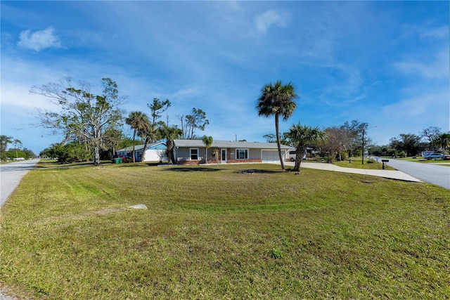 ranch-style house with a front lawn