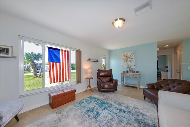 living room with light tile patterned floors