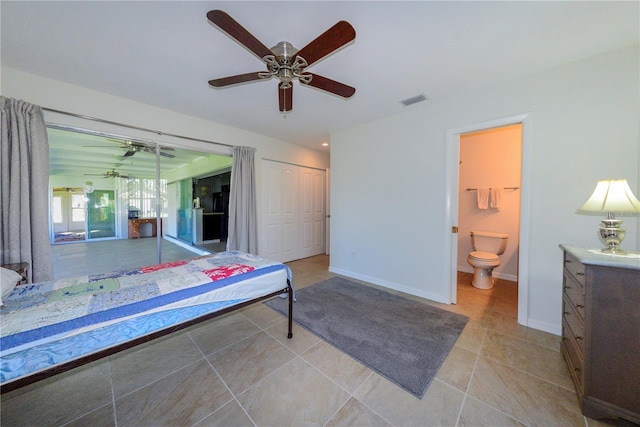 unfurnished bedroom featuring connected bathroom, light tile patterned floors, and ceiling fan