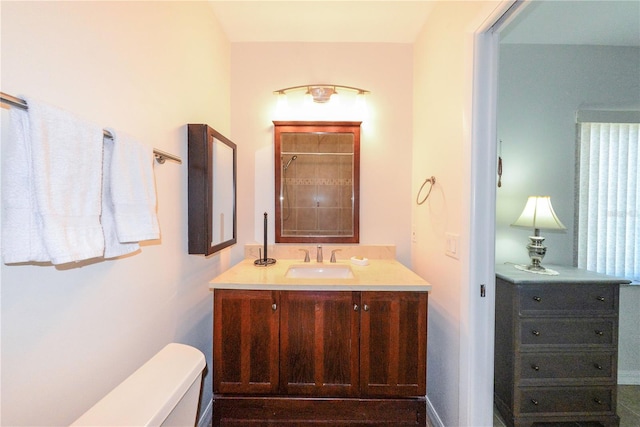 bathroom featuring vanity and toilet