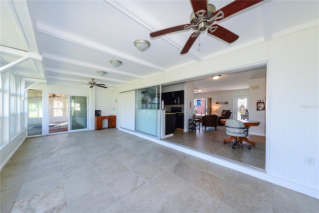 unfurnished sunroom featuring beam ceiling