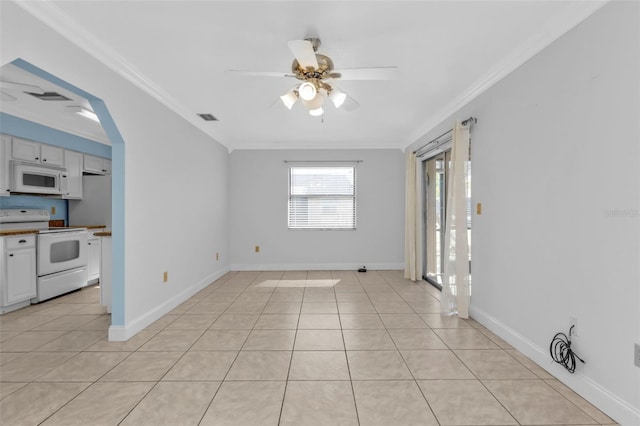 unfurnished room featuring light tile patterned floors, crown molding, and ceiling fan