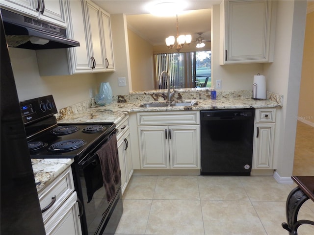 kitchen with sink, a chandelier, hanging light fixtures, light stone countertops, and black appliances