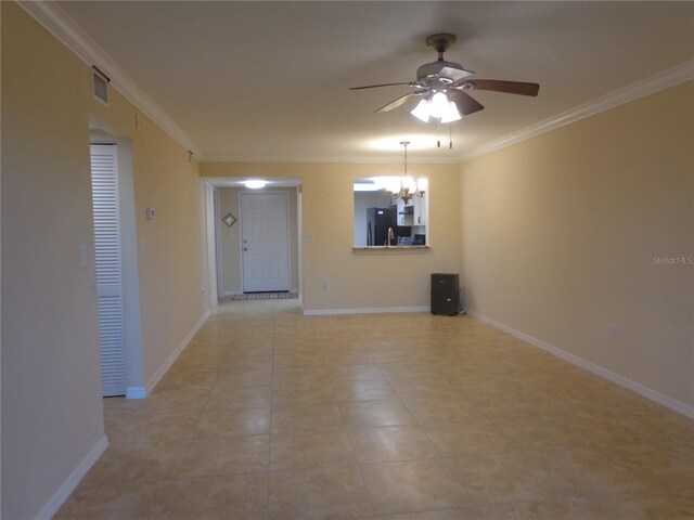 tiled spare room featuring crown molding and ceiling fan with notable chandelier