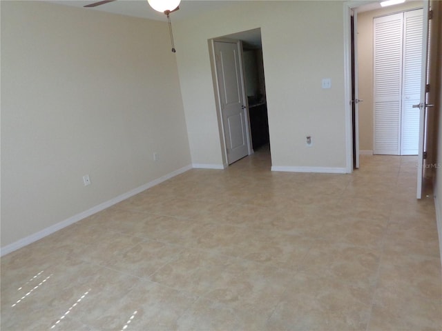 unfurnished bedroom featuring ceiling fan