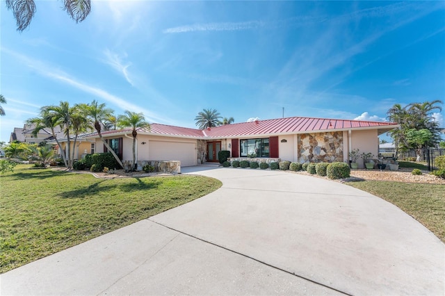 single story home with a garage and a front lawn