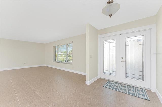 tiled foyer with french doors