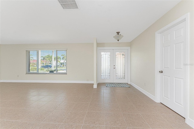 tiled foyer with french doors