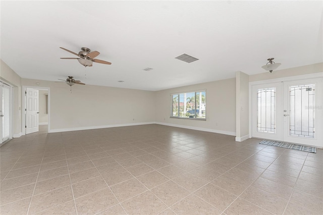 interior space with ceiling fan and french doors