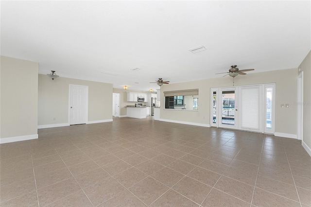 unfurnished living room featuring ceiling fan and light tile patterned flooring