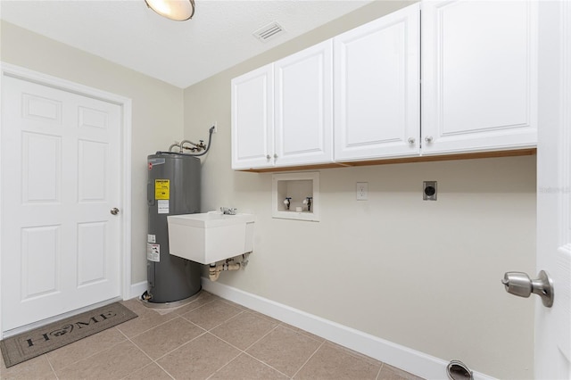 washroom featuring light tile patterned floors, electric dryer hookup, cabinets, electric water heater, and washer hookup