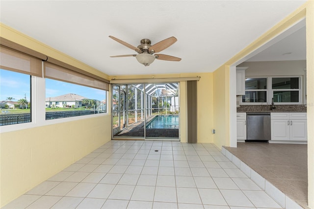 interior space with ceiling fan