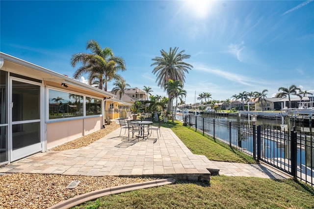 view of patio with a water view