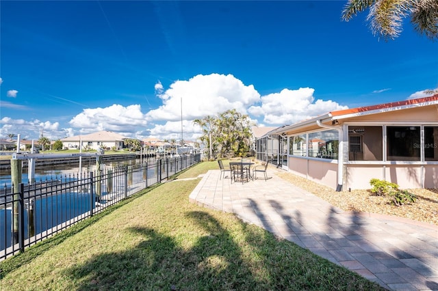 view of yard with a patio and a water view