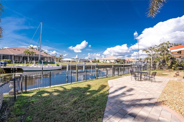 exterior space featuring a yard, a patio, and a water view