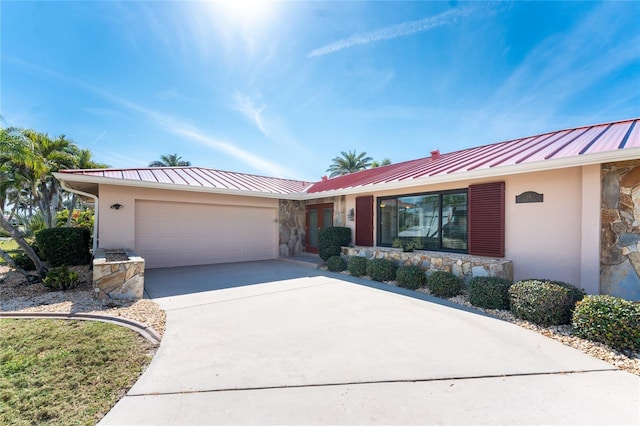 ranch-style house featuring a garage