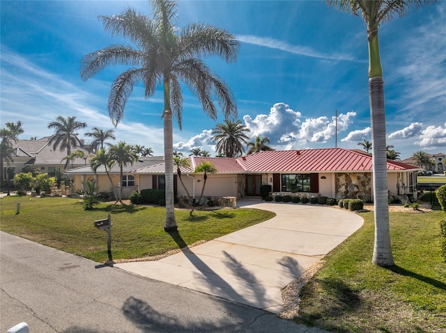 ranch-style home with a front yard