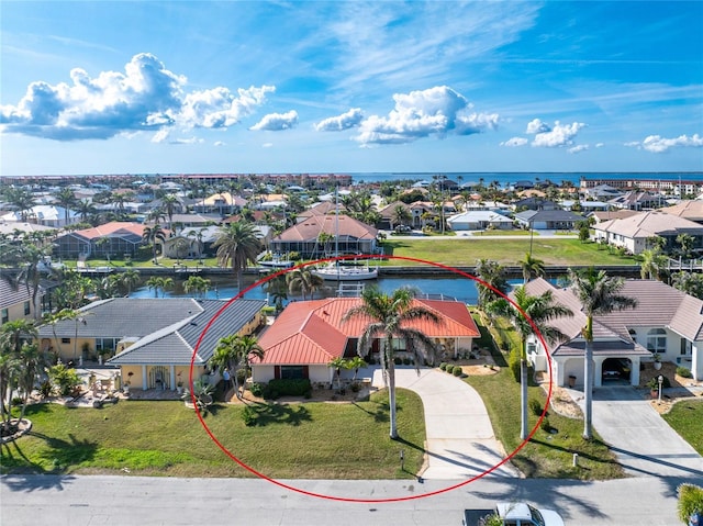 birds eye view of property with a water view