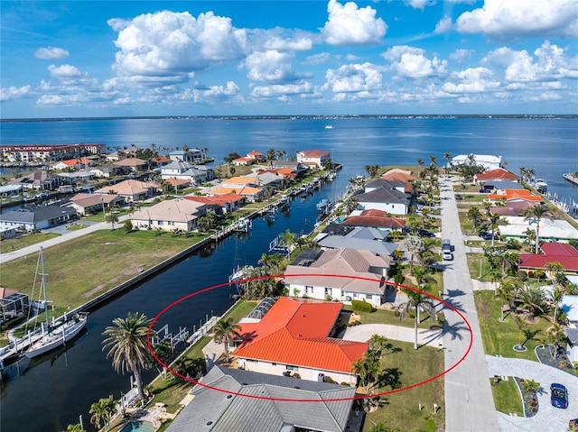 birds eye view of property with a water view