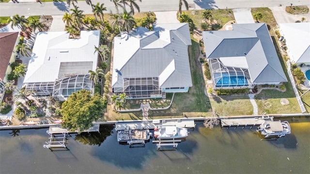 birds eye view of property with a water view