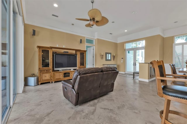 living room with ceiling fan, french doors, and crown molding