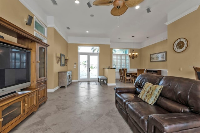 living room with ceiling fan with notable chandelier, french doors, and crown molding