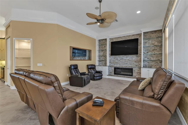 living room with ceiling fan, ornamental molding, built in shelves, and a stone fireplace