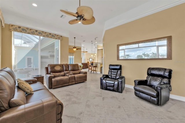 living room featuring ceiling fan, crown molding, and tile patterned floors