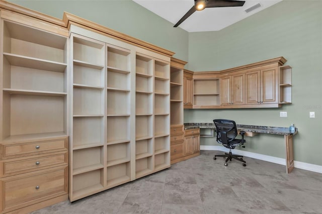 office area featuring ceiling fan and built in desk