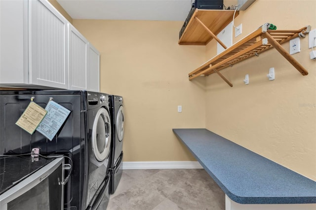 clothes washing area featuring washer and clothes dryer