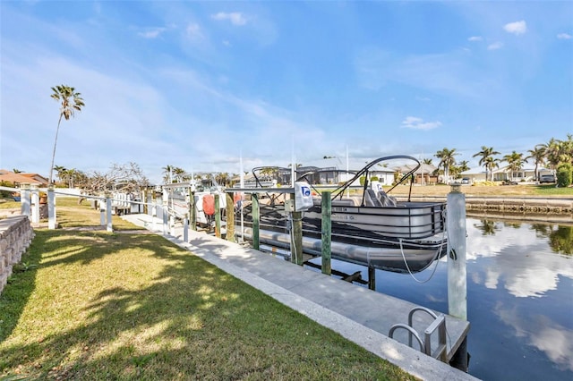 dock area featuring a yard and a water view