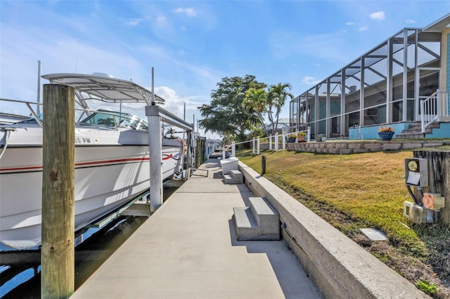 view of dock featuring a yard and glass enclosure