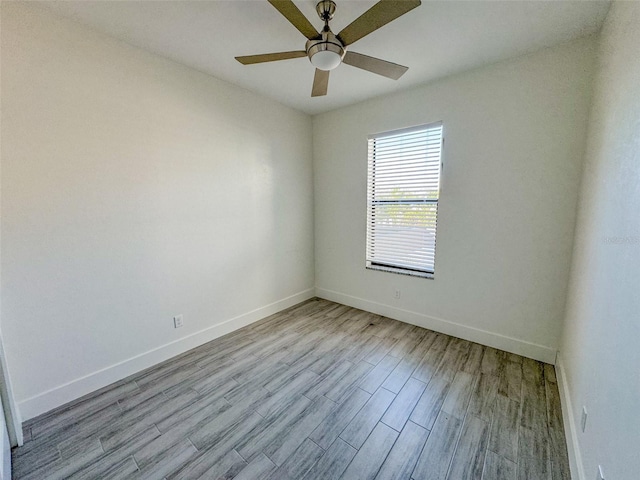 empty room featuring ceiling fan and light hardwood / wood-style floors