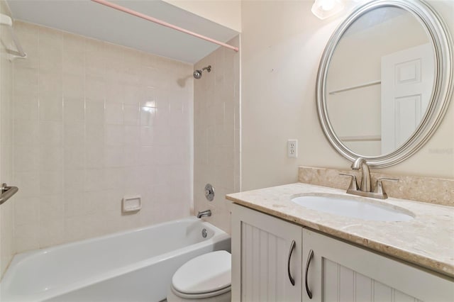 full bathroom featuring vanity, toilet, and tiled shower / bath combo