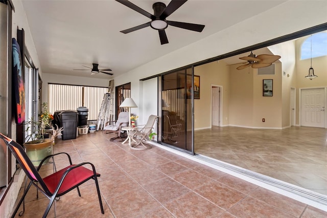 sunroom / solarium with ceiling fan