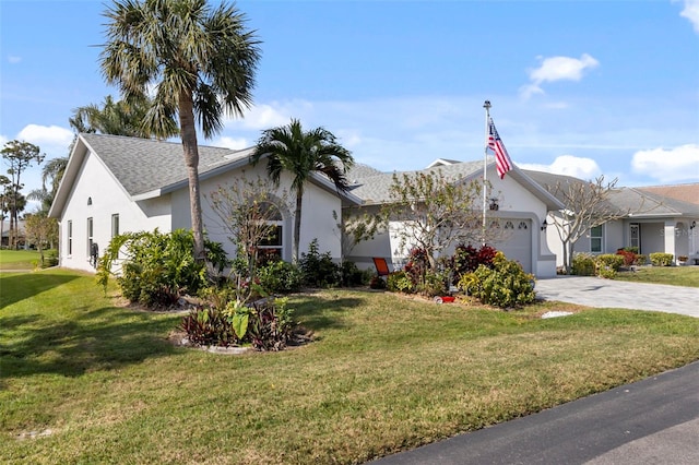 view of front facade featuring a garage and a front lawn