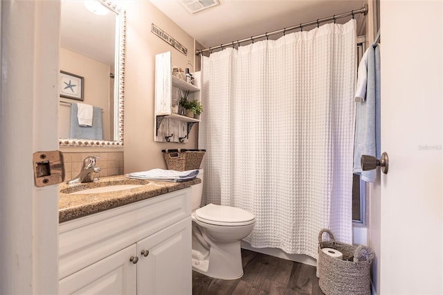 bathroom featuring toilet, wood-type flooring, vanity, curtained shower, and backsplash