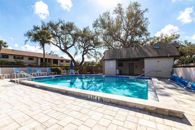 view of swimming pool featuring a patio area