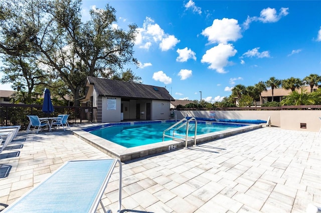 view of swimming pool featuring a patio